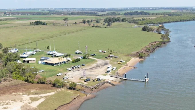 Aerial view of the Bundaberg Sailing Club grounds, boat ramp and pontoon on the Burnett River